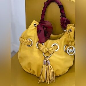 Michael Kors Yellow Handbag with Tassel and Red Accents